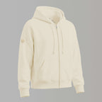 Frontaufnahme: Spirituelle Damen Bio Sweatjacke aus 100% Biobaumwolle, Farbton Natural Raw: unbehandelte und ungefärbte Baumwolle, große edel schimmernde Rückenstickerei mit Affirmation "Trust yourself", Logostickerei am rechten Ärmel: Logo der spirituellen Modemarke Leitstern
